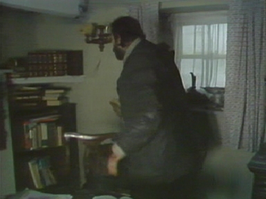 Charles searches the shelves for Fenton's notes