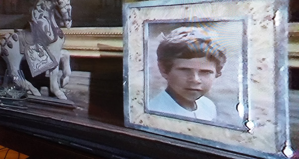 A framed photo of Abby Grant's son Peter Grant